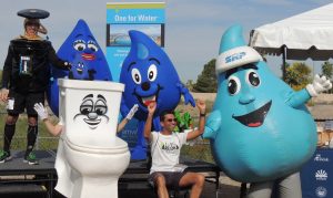 Showing they are “One for Water” is (left to right) Ewing Irrigation’s Rowdy Rotor, Peoria’s Misty, AMWUA’s Leaky ‘Loo’ McFlapper (with EPA’s ‘Flo’ on the tank), WUIW’s Wayne Drop, a Fix a Leak Week race participant, and SRP’s Dewey)